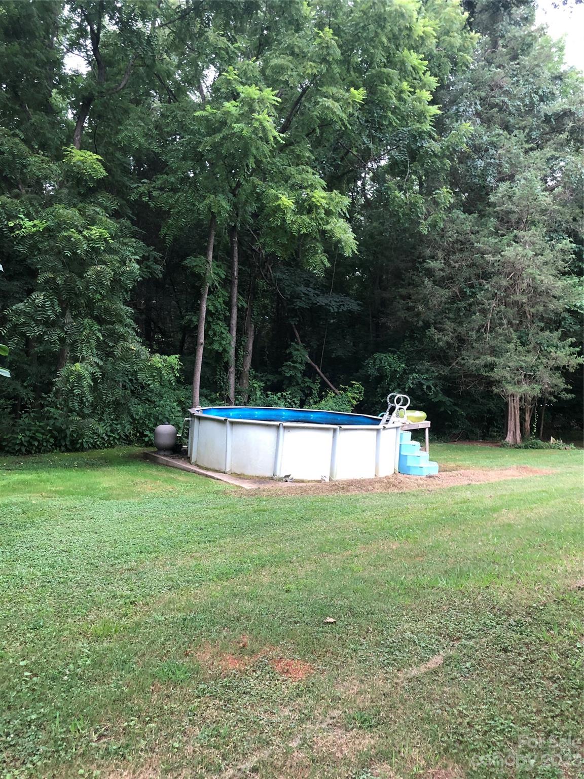 1417 Woodridge Road, Unit 31 Clover, SC 29710 - Photo 6 of 22 a view of a field with trees in the background