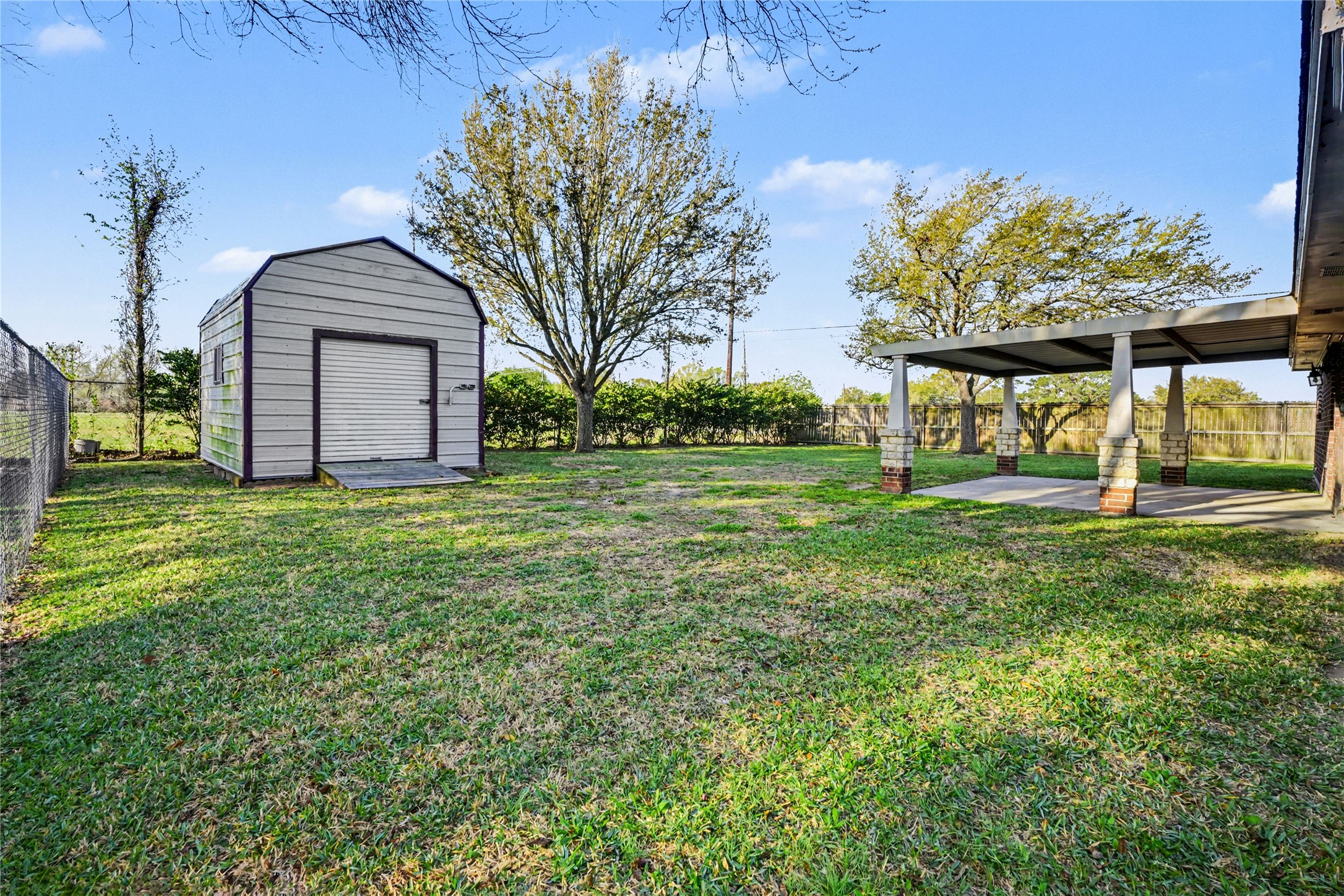 12431 9th Street Santa Fe, TX 77510 - Photo 16 of 18 a view of a house with yard and a garden