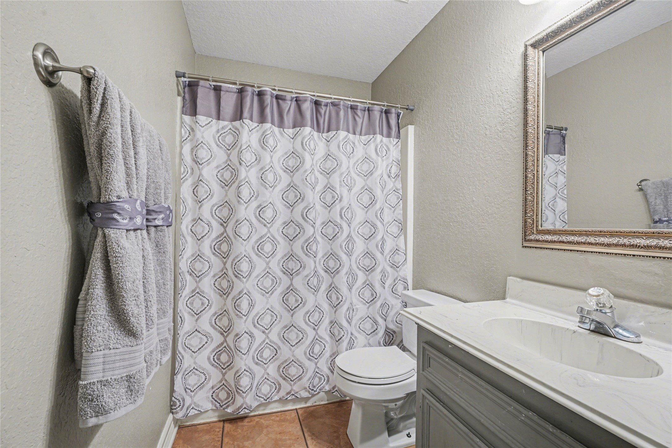 12431 9th Street Santa Fe, TX 77510 - Photo 9 of 18 a bathroom with a sink toilet and shower