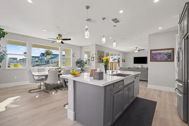 a living room with furniture and a workspace