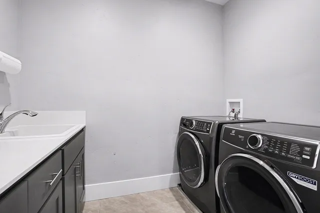 a bed room with a bed and a chandelier