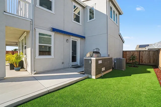 a view of a lake with houses in front of it