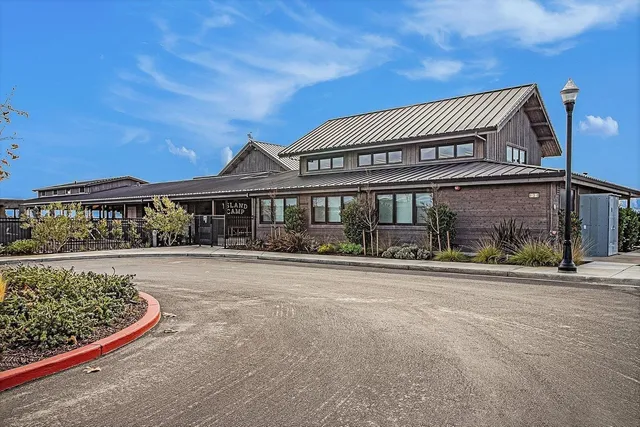 a living room with lots of furniture and a wooden floor