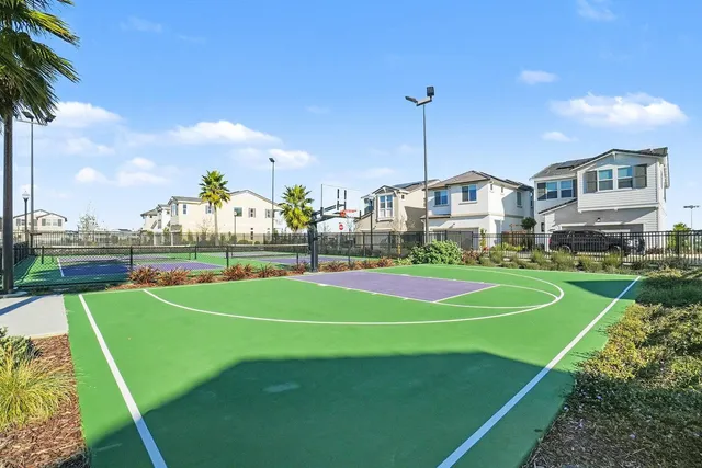 a view of yard with swimming pool and seating