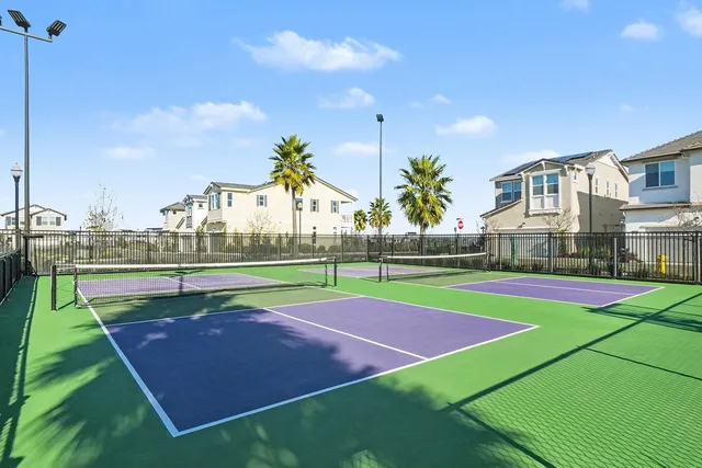 a view of a patio with table and chairs