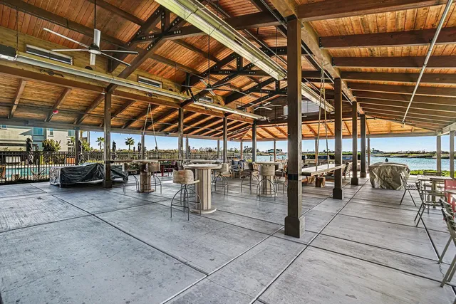 a view of an house with backyard space and balcony