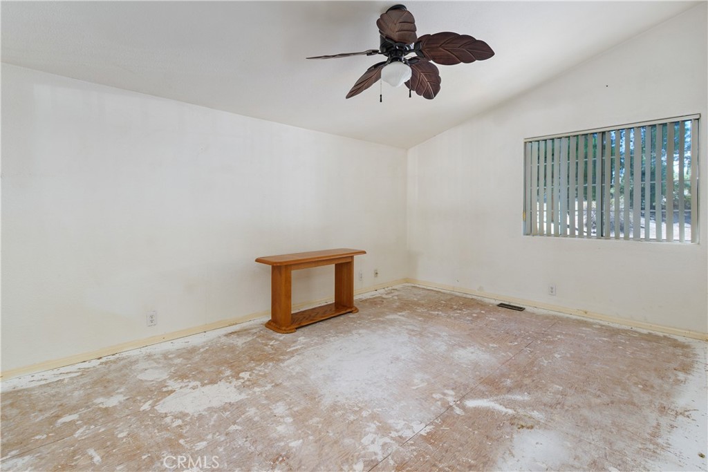 34881 Los Nogales Road Temecula, CA 92592 - Photo 34 of 50 Bedroom 2-needs flooring and paint. It has a Ceiling fan and mirrored closet doors.