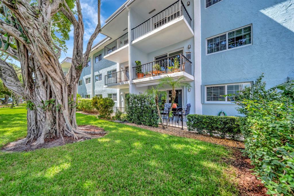 3000 Northeast 5th Terrace, Unit 109A Wilton Manors, FL 33334 - Photo 15 of 36 a view of a house with a yard and sitting area