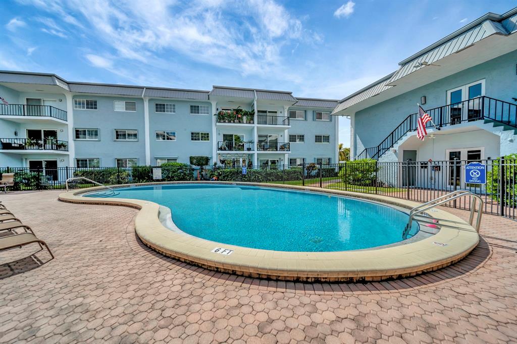 3000 Northeast 5th Terrace, Unit 109A Wilton Manors, FL 33334 - Photo 19 of 36 a view of outdoor space yard swimming pool and porch