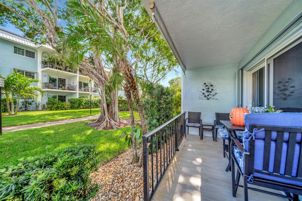3000 Northeast 5th Terrace, Unit 109A Wilton Manors, FL 33334 - Photo 30 of 36 a view of a house with backyard and sitting area