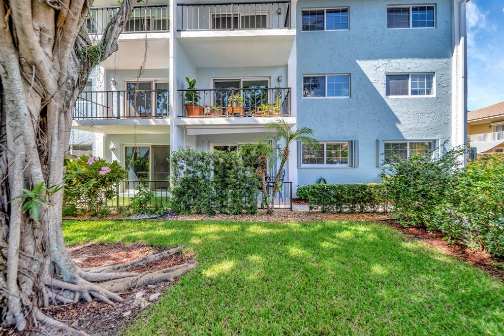 3000 Northeast 5th Terrace, Unit 109A Wilton Manors, FL 33334 - Photo 31 of 36 front view of a house with a yard