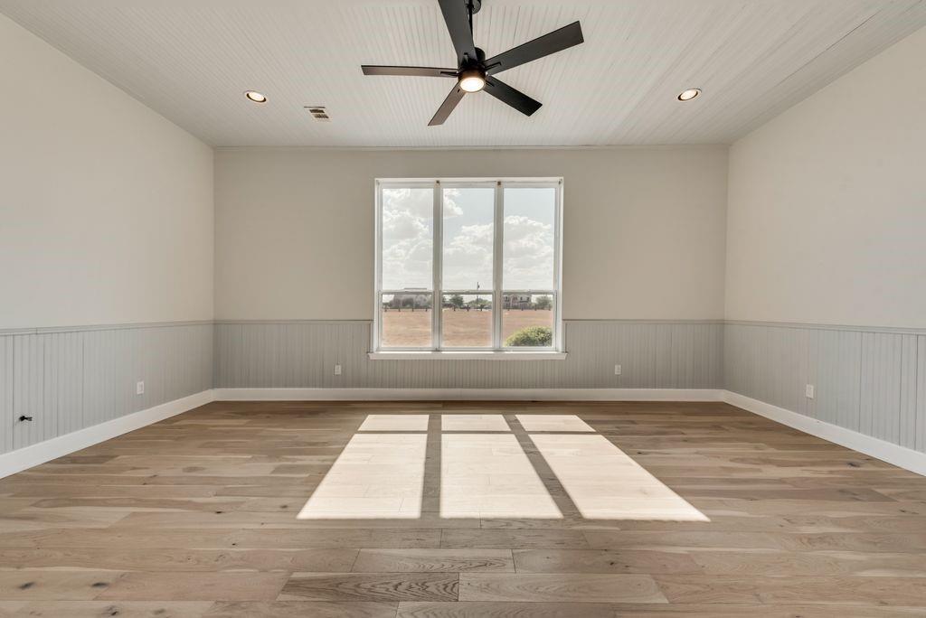 3330 Greathouse Road Waxahachie, TX 75167 - Photo 21 of 40 a view of empty room with wooden floor and fan