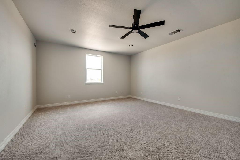 3330 Greathouse Road Waxahachie, TX 75167 - Photo 24 of 40 a view of a big room with windows and ceiling fan