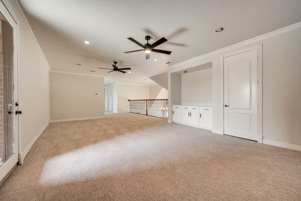 3330 Greathouse Road Waxahachie, TX 75167 - Photo 32 of 40 an empty room with a ceiling fan and a window