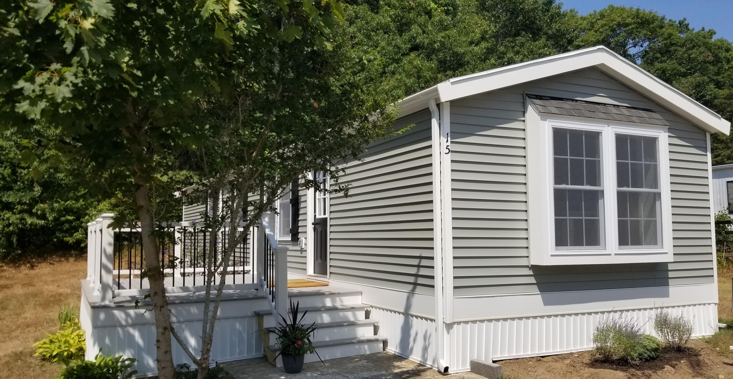 15 1st Street Bourne, MA 02559 - Photo 1 of 30 a front view of a house with a yard