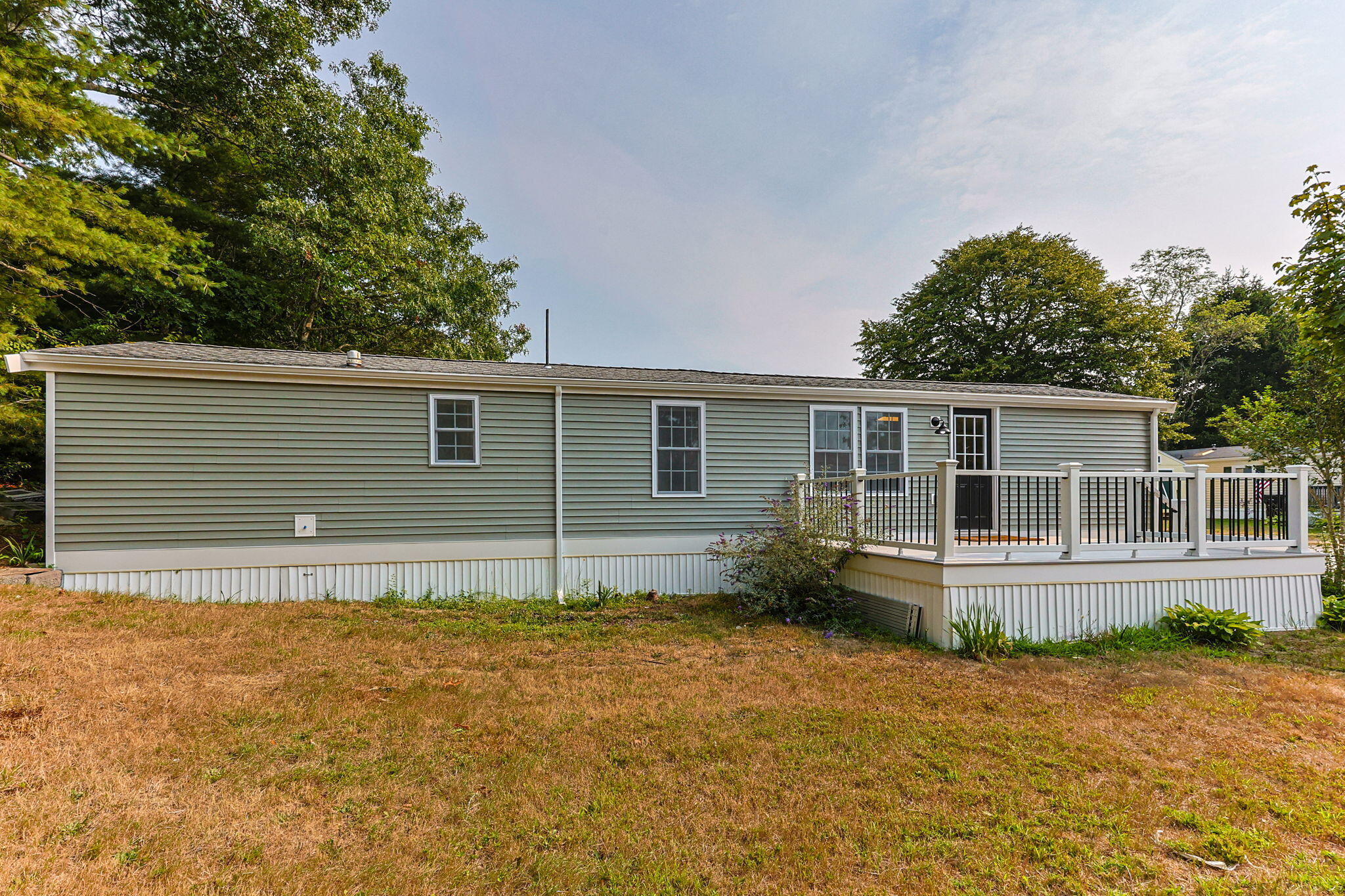 15 1st Street Bourne, MA 02559 - Photo 4 of 30 front view of house with a yard