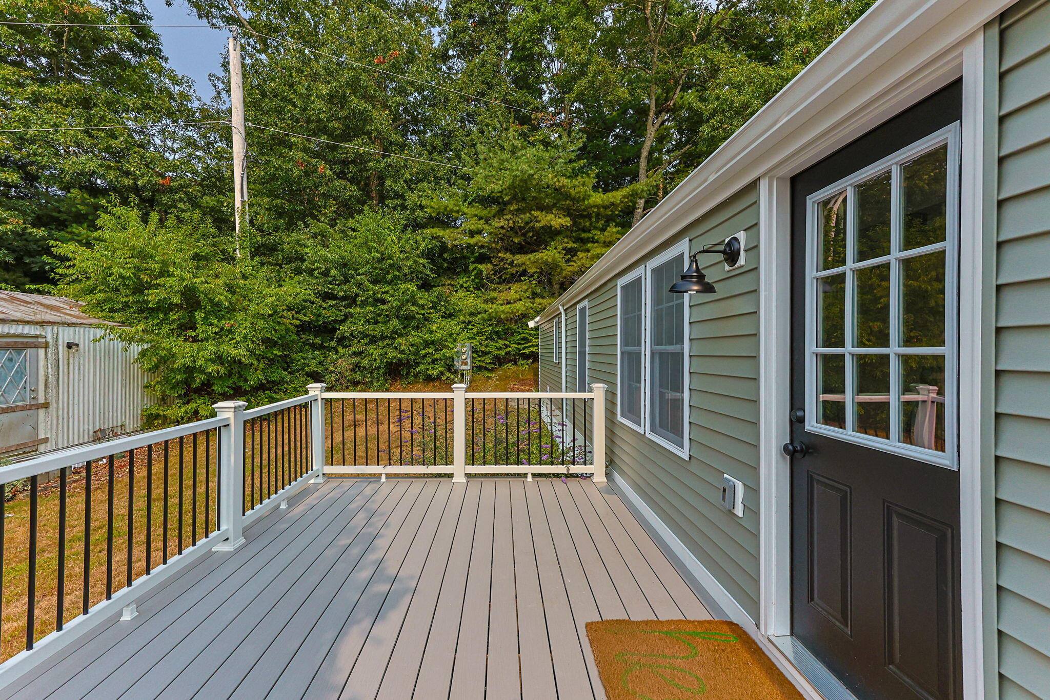 15 1st Street Bourne, MA 02559 - Photo 6 of 30 a view of balcony with wooden floor and fence
