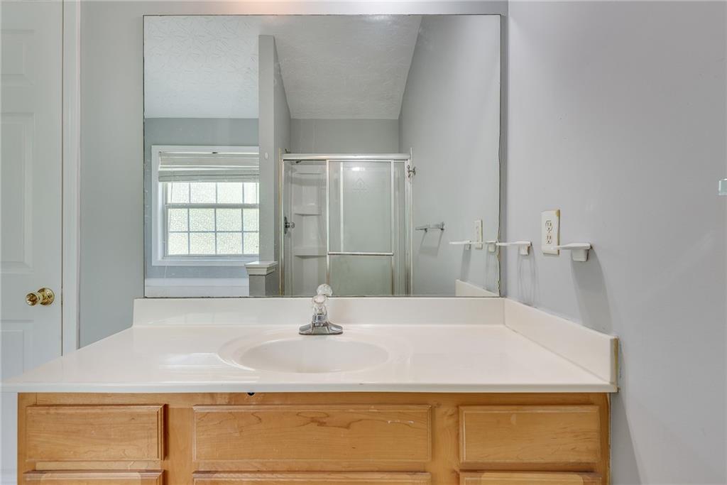 3337 Baymount Way Lawrenceville, GA 30043 - Photo 30 of 47 a bathroom with a sink and a mirror