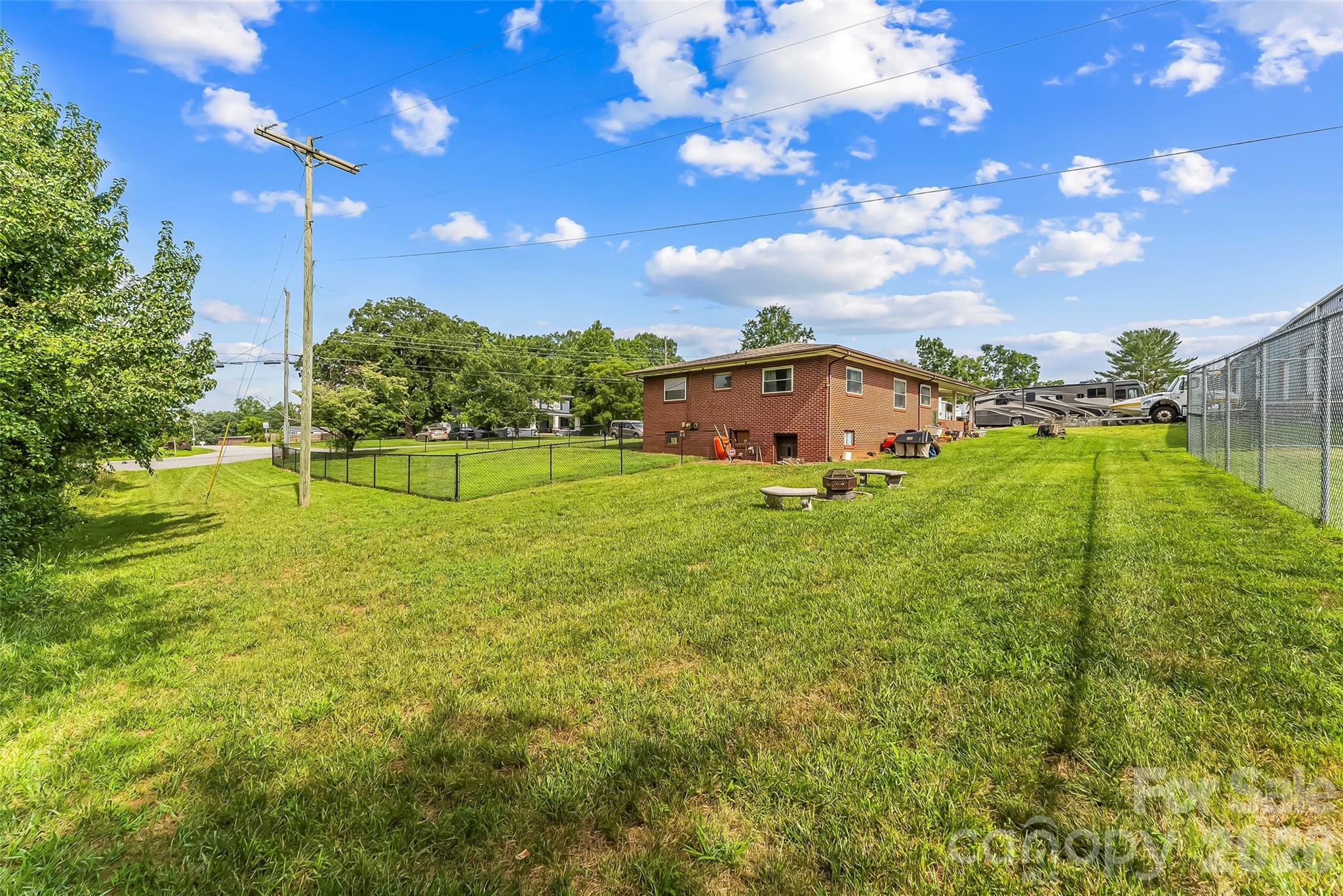 691 Central Street Hudson, NC 28638 - Photo 20 of 22 a view of a big yard with swimming pool and green space