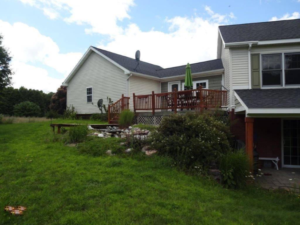 694 North Stiles Road Ludington, MI 49431 - Photo 3 of 50 Back of House side view