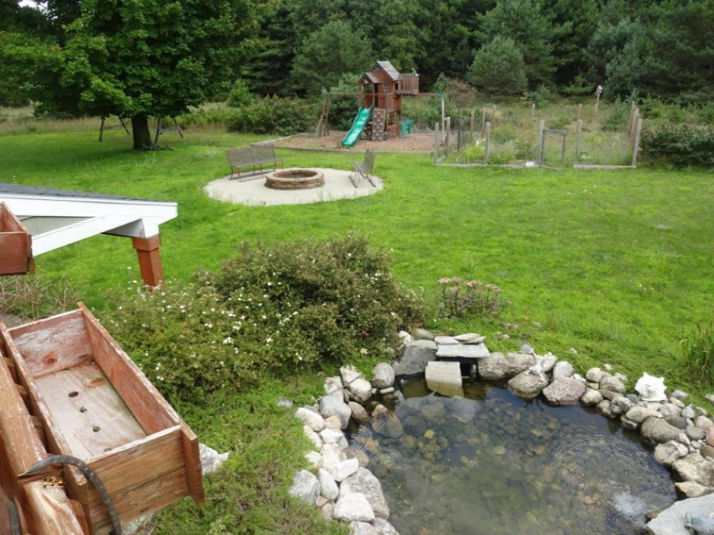 694 North Stiles Road Ludington, MI 49431 - Photo 46 of 50 pond and yard view