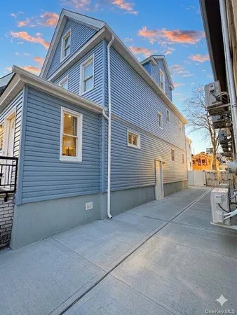 a view of a house with a street