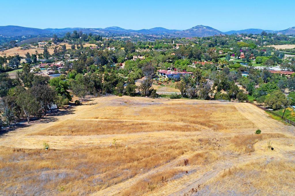 a view of a town with mountains in the background