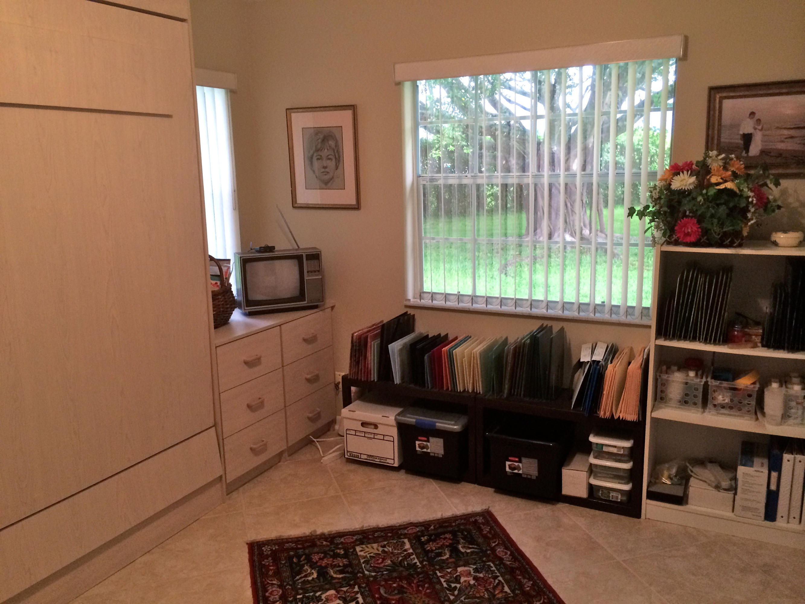 7540 Diamond Pointe Circle Delray Beach, FL 33446 - Photo 15 of 18 a living room with furniture a flat screen tv and a window