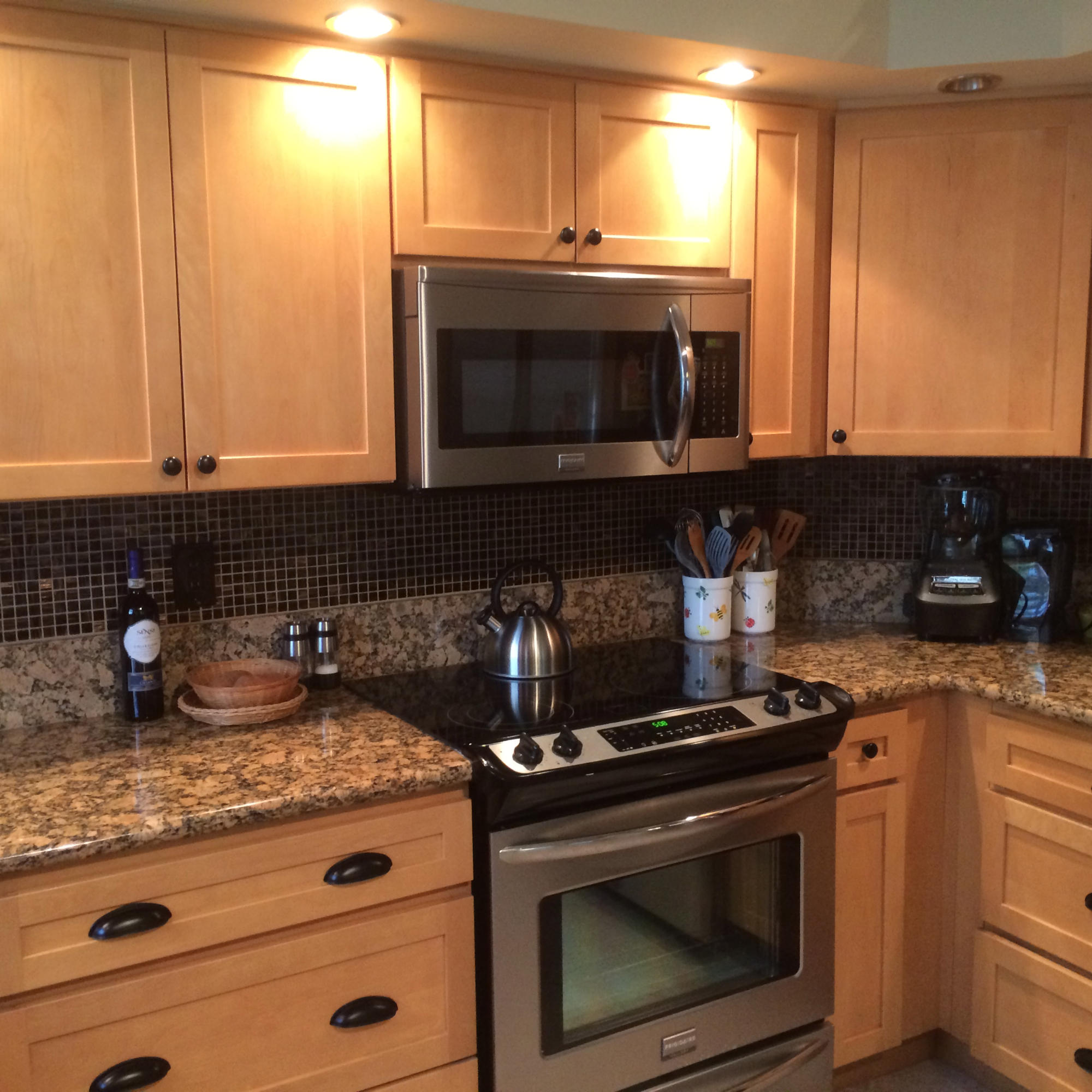 7540 Diamond Pointe Circle Delray Beach, FL 33446 - Photo 4 of 18 a kitchen with granite countertop a stove and a sink