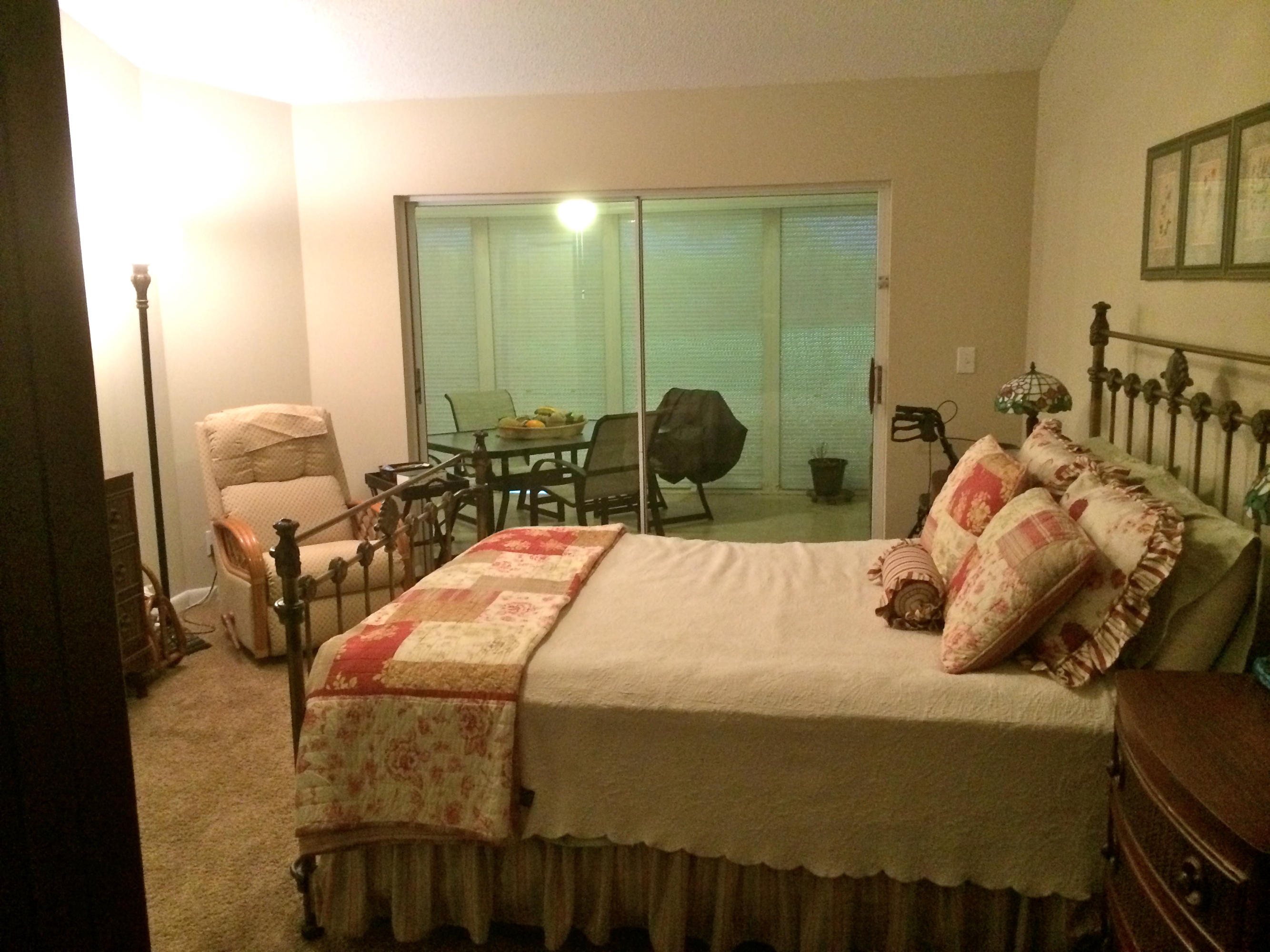 7540 Diamond Pointe Circle Delray Beach, FL 33446 - Photo 9 of 18 a bedroom with two beds and a chandelier