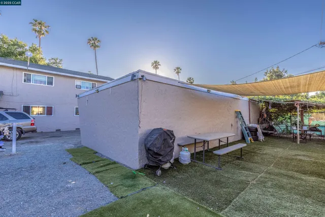 an aerial view of a house with yard swimming pool and outdoor seating