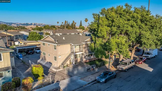 an aerial view of residential houses with outdoor space