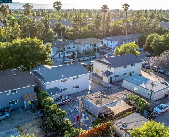 a aerial view of a house with a yard and plants