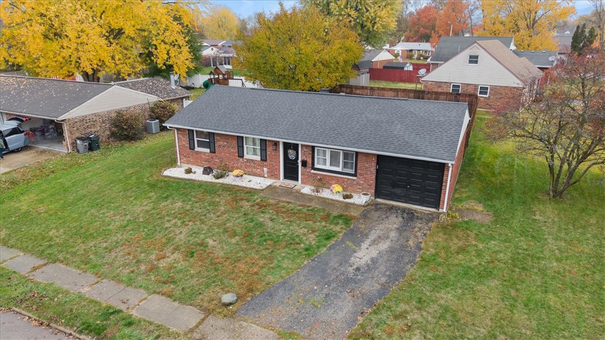 1482 Lee Road Troy, OH 45373 - Photo 27 of 30 This charming residence features a classic brick exterior and a well-maintained front yard with a driveway.
