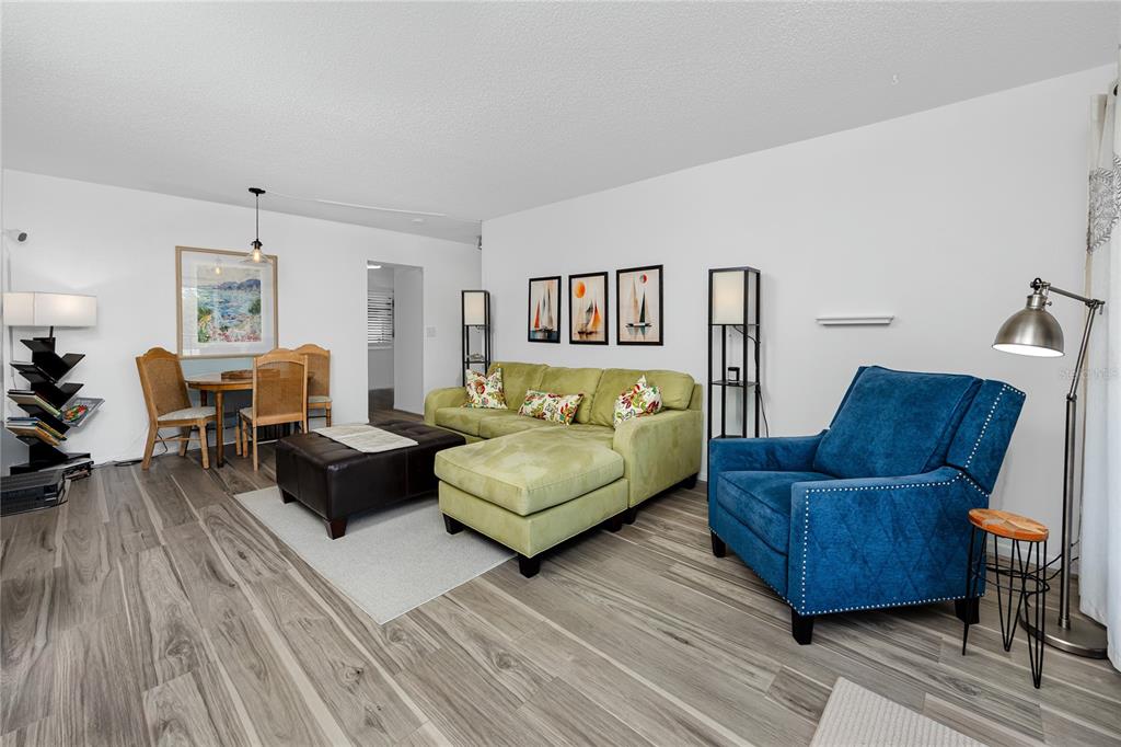 2207 Belleair Road, Unit B30 Clearwater, FL 33764 - Photo 8 of 39 a living room with furniture and a wooden floor