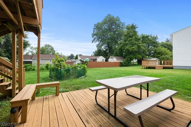 a view of a backyard with sitting area