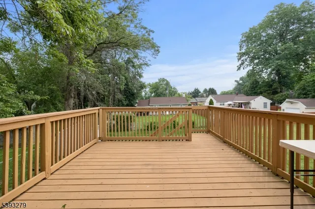 a deck with trees in front of it
