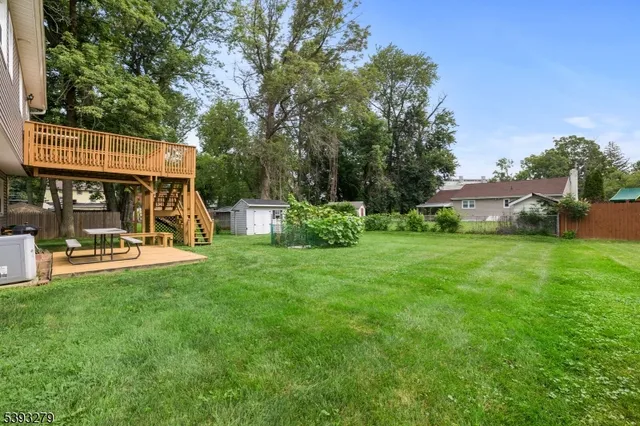 a view of a house with backyard porch and sitting area
