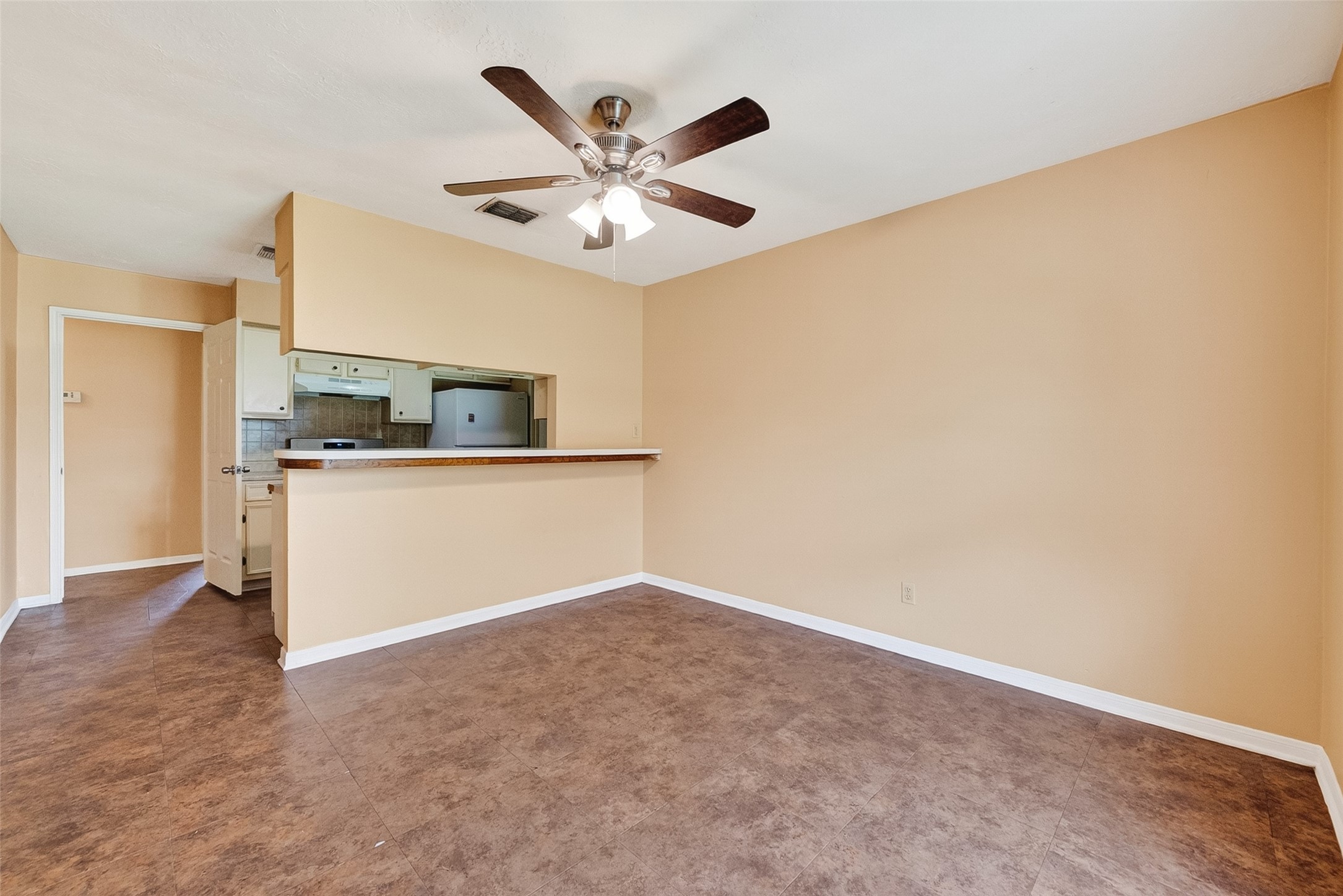4826 Redfish Reef Drive Bacliff, TX 77518 - Photo 6 of 25 an empty room with a kitchen and a sink