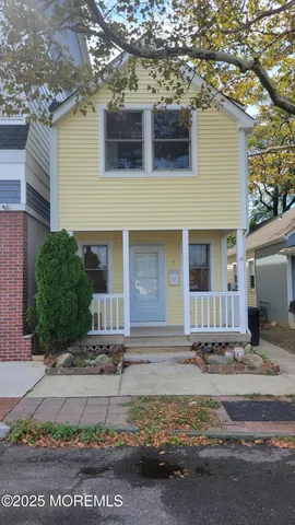 a front view of a house with garage