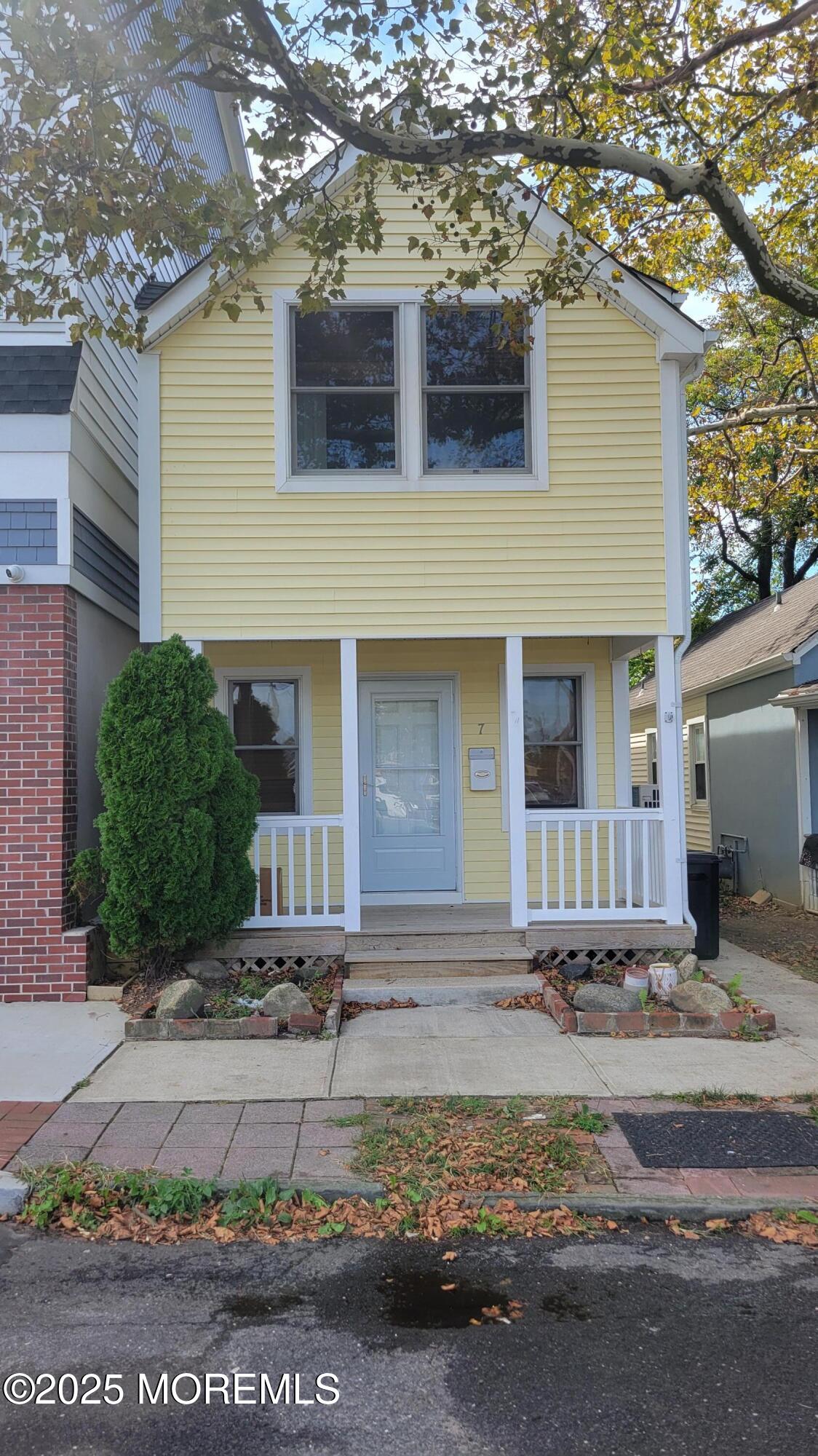 Undisclosed Address Long Branch, NJ 07740 - Photo 1 of 22 a front view of a house with garage
