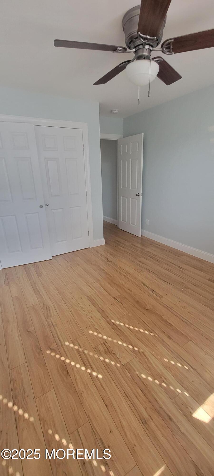 Undisclosed Address Long Branch, NJ 07740 - Photo 17 of 22 a view of empty room with wooden floor