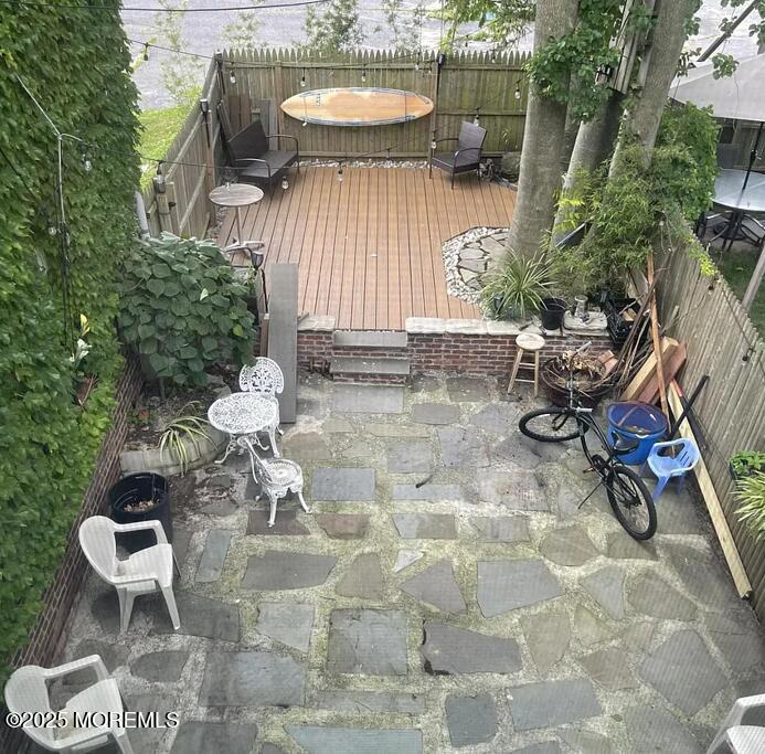Undisclosed Address Long Branch, NJ 07740 - Photo 3 of 22 a view of a chairs and table in backyard