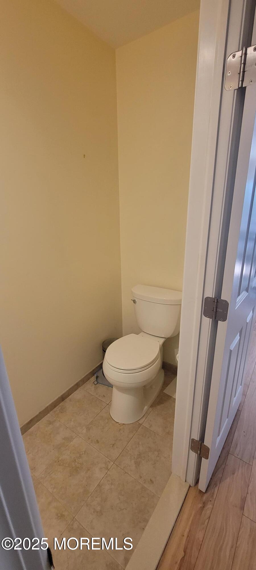 Undisclosed Address Long Branch, NJ 07740 - Photo 9 of 22 a white toilet sitting next to a shower