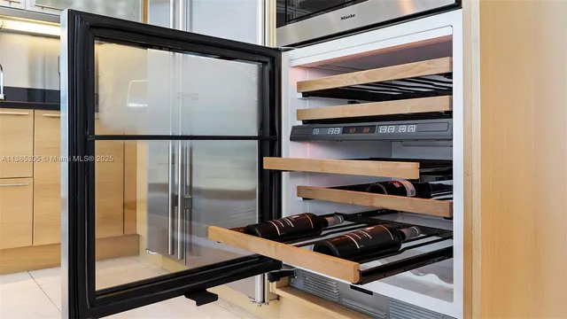 a kitchen with granite countertop a stove a sink and a refrigerator