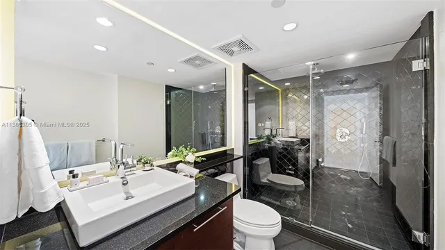 a bathroom with a sink vanity and a mirror
