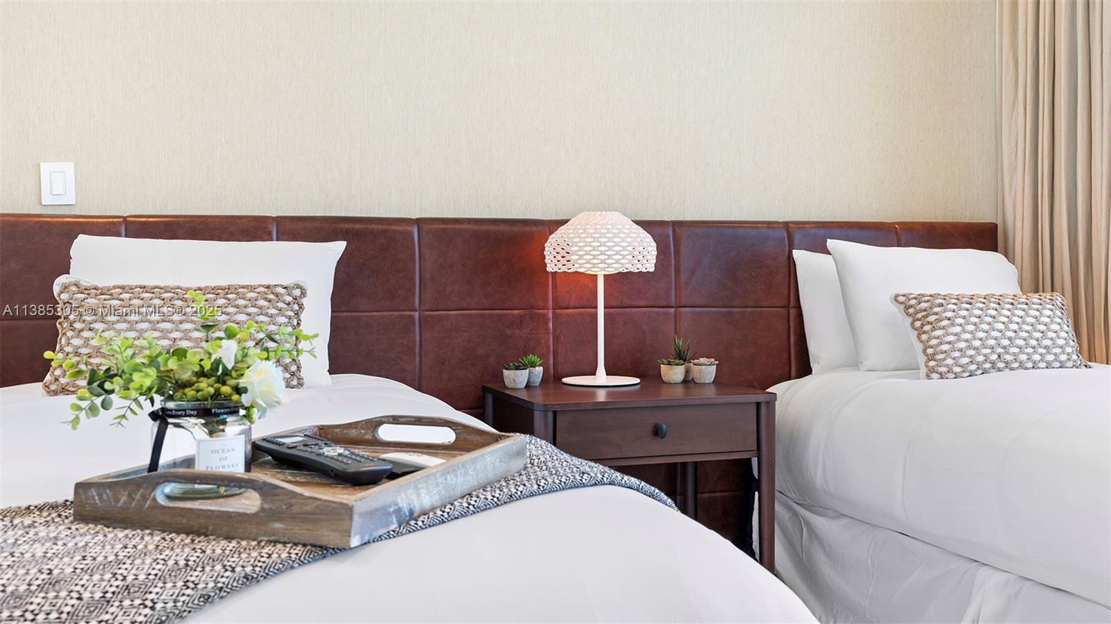 101 20th Street, Unit 3903 Miami Beach, FL 33139 - Photo 31 of 46 a bedroom with a bed and a potted plant