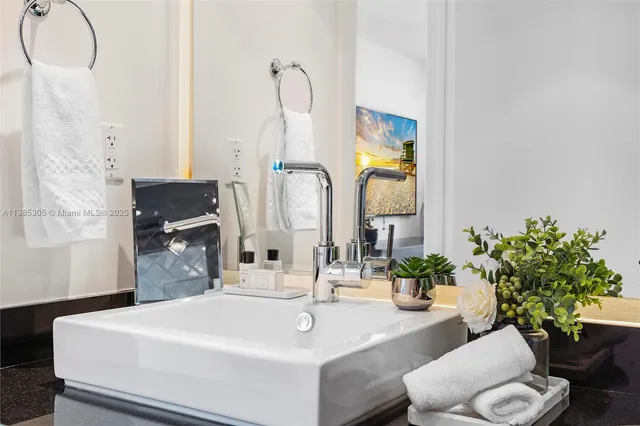 a bedroom with a large bed and a lamp