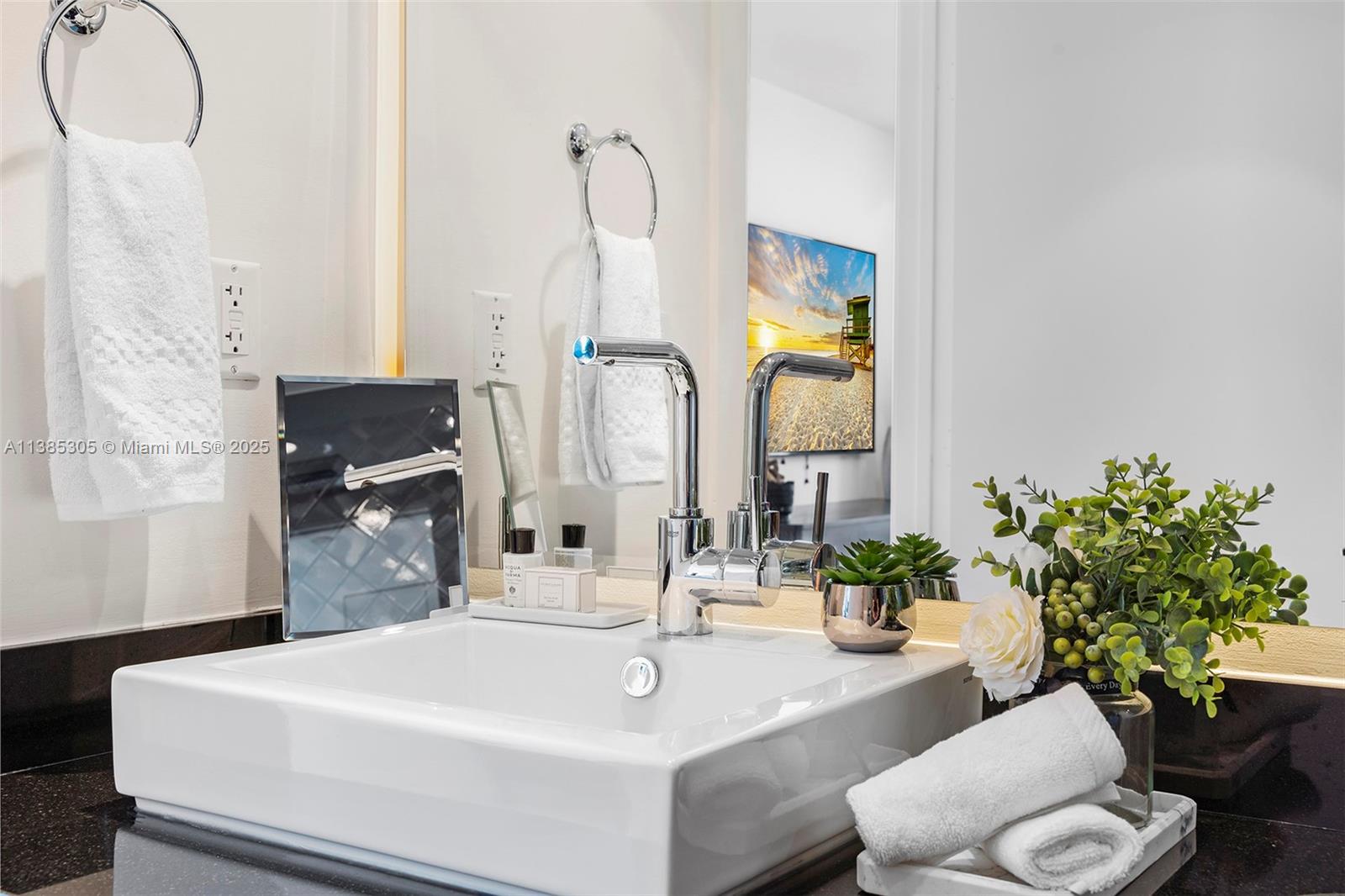 101 20th Street, Unit 3903 Miami Beach, FL 33139 - Photo 34 of 46 a bathroom with a sink and a mirror