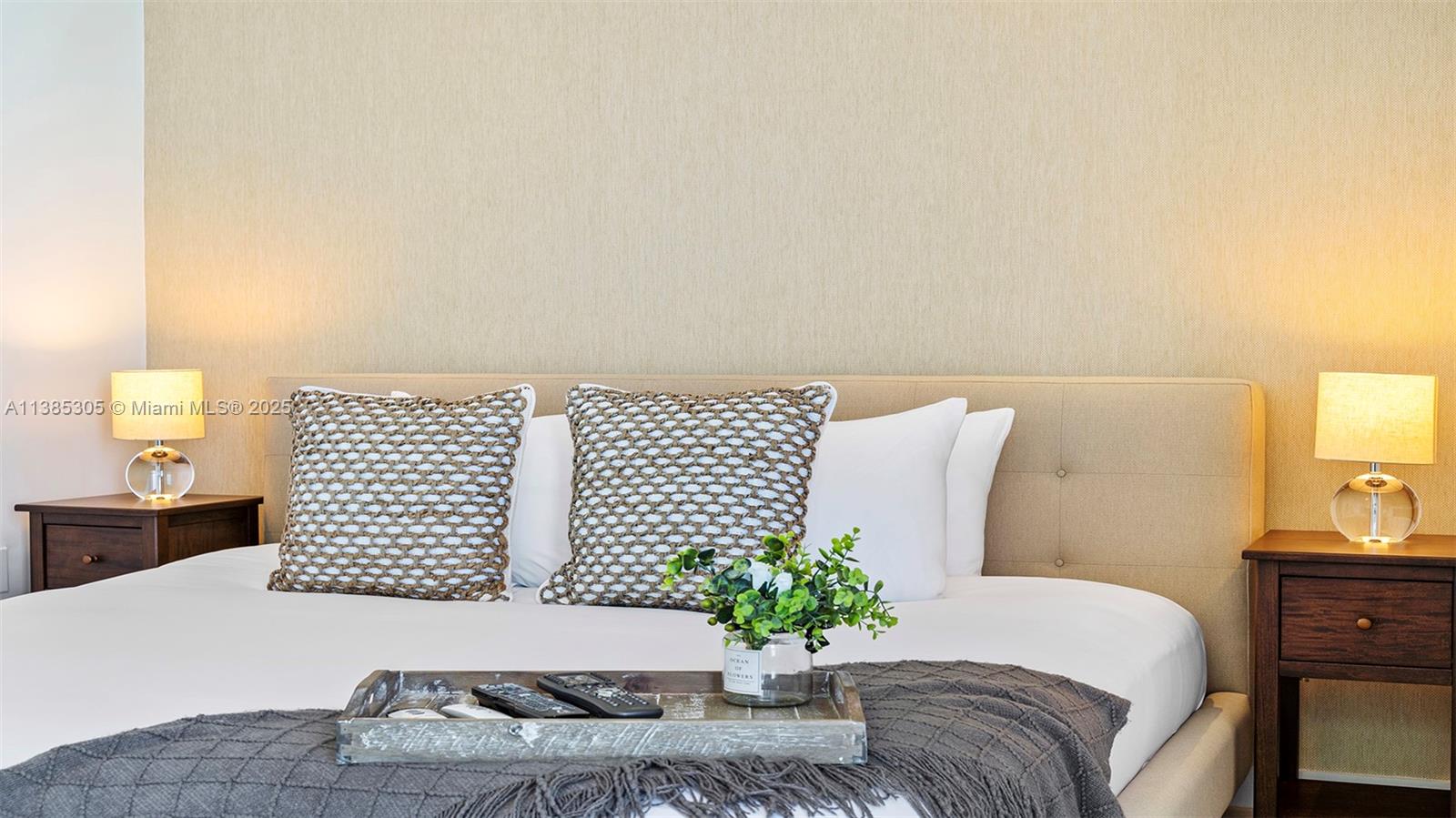 101 20th Street, Unit 3903 Miami Beach, FL 33139 - Photo 35 of 46 a bedroom with a large bed and a lamp